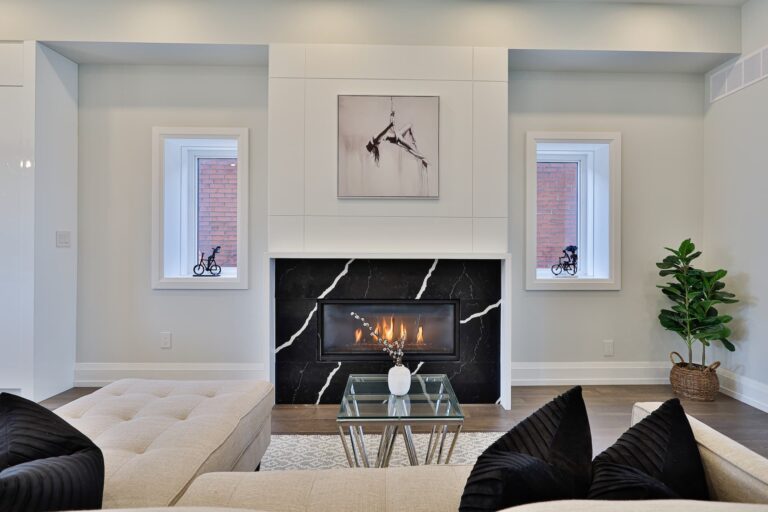 Chic-Living-Room-With-Wall-Art-And-Fireplace