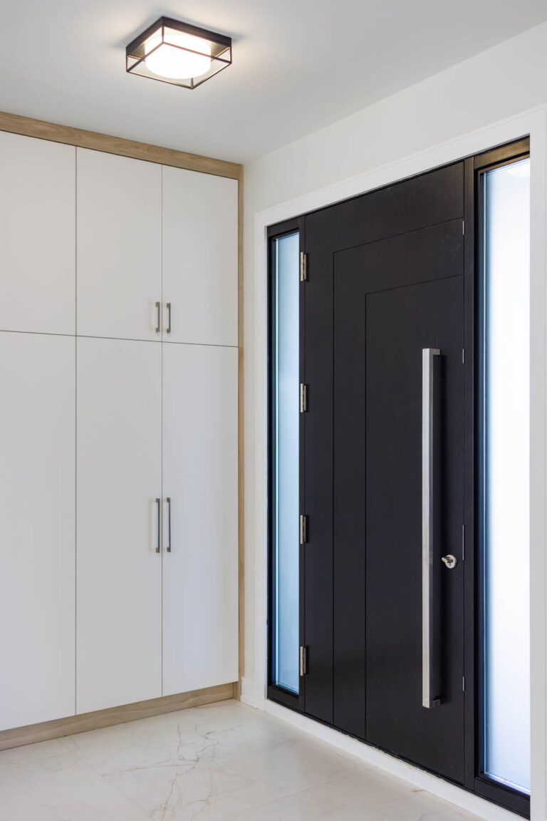 Modern-Hallway-With-White-Closet-And-Black-Entry-Door