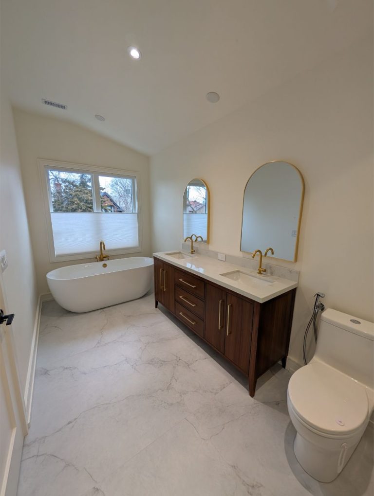 bathroom-with-dual-arched-mirrors and white tub