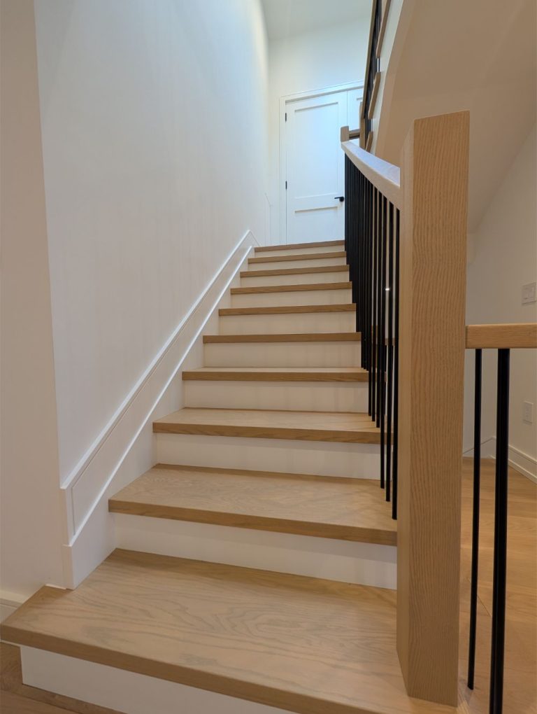 contemporary-lower-level-stairs-with-oak-steps