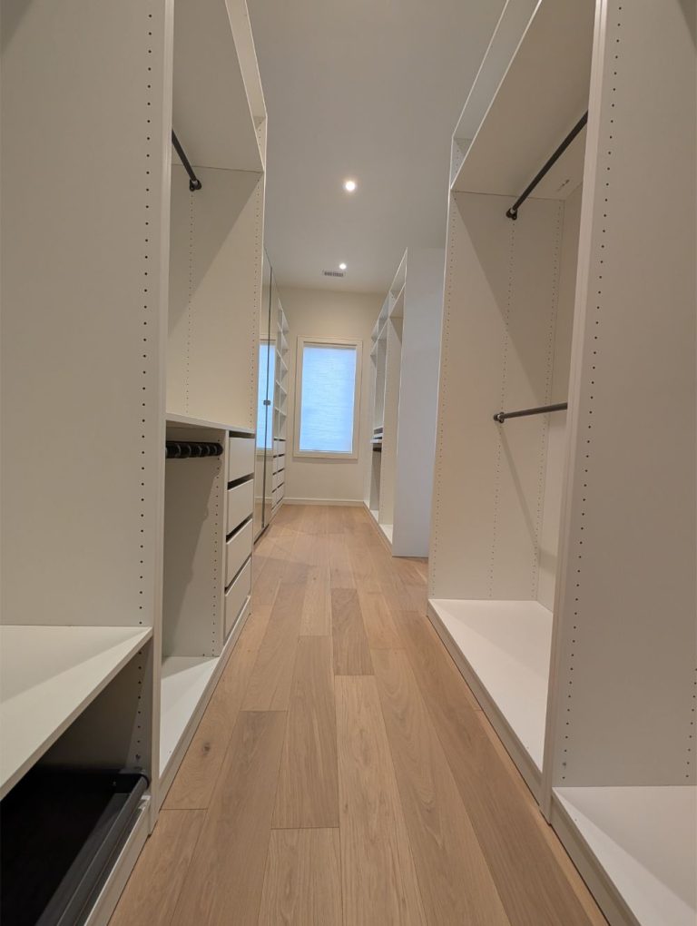 hallway with white cabinets