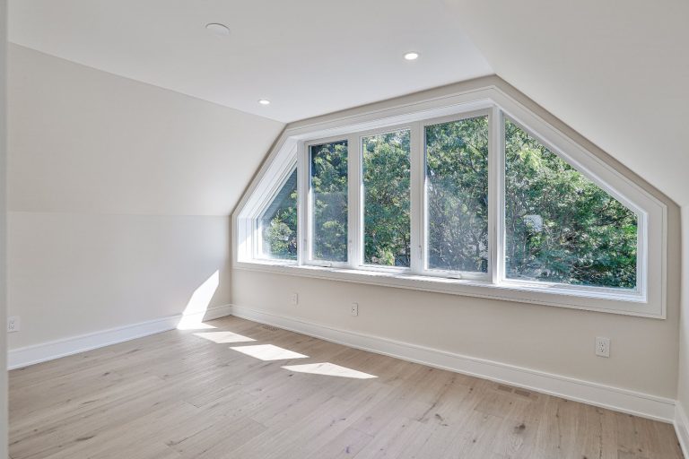 light-filled-upstairs-primary-bedroom-with-hardwood-floors