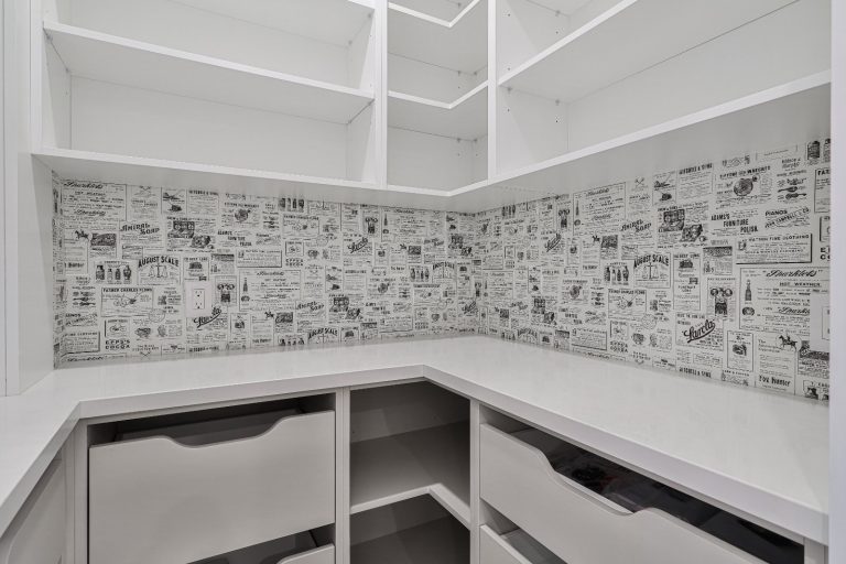 luxury-pantry-with-vintage-newspaper-wallpaper-backsplash
