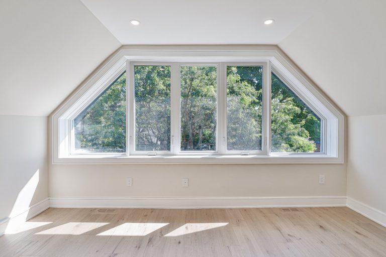 luxury-upper-level-bedroom-gabled-window-feature