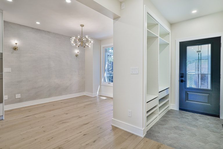 modern entryway with white closet