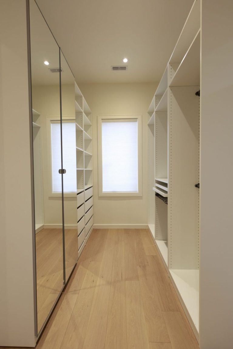 modern hallway with white closets