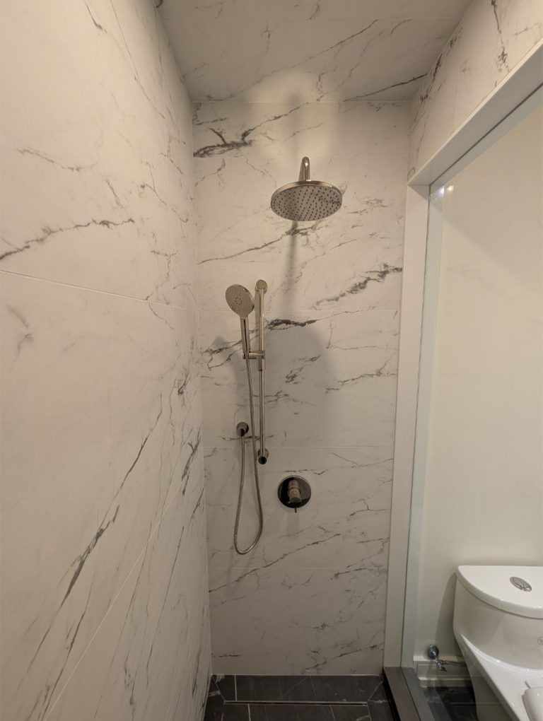 modern shower design with marble walls